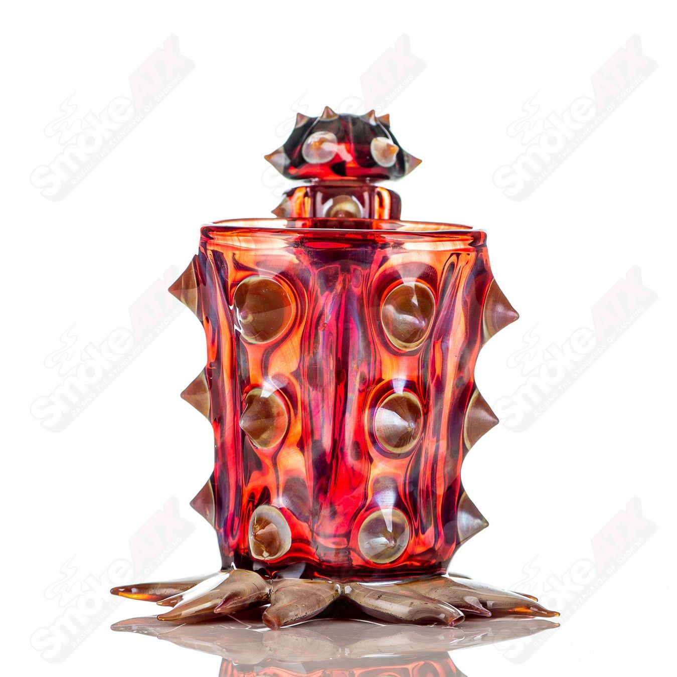 Red cactus-shaped Iso/Qtip jar by Unparalleled Glass, a stylish heady glass piece with a unique cactus design.