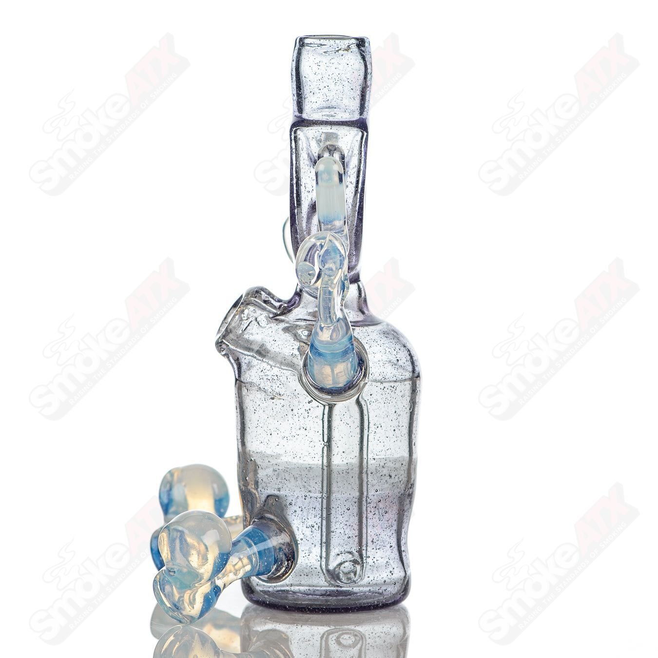 MJ Meltz CFL Sitter Rig, a heady glass concentrate rig with vibrant colors and intricate design details.