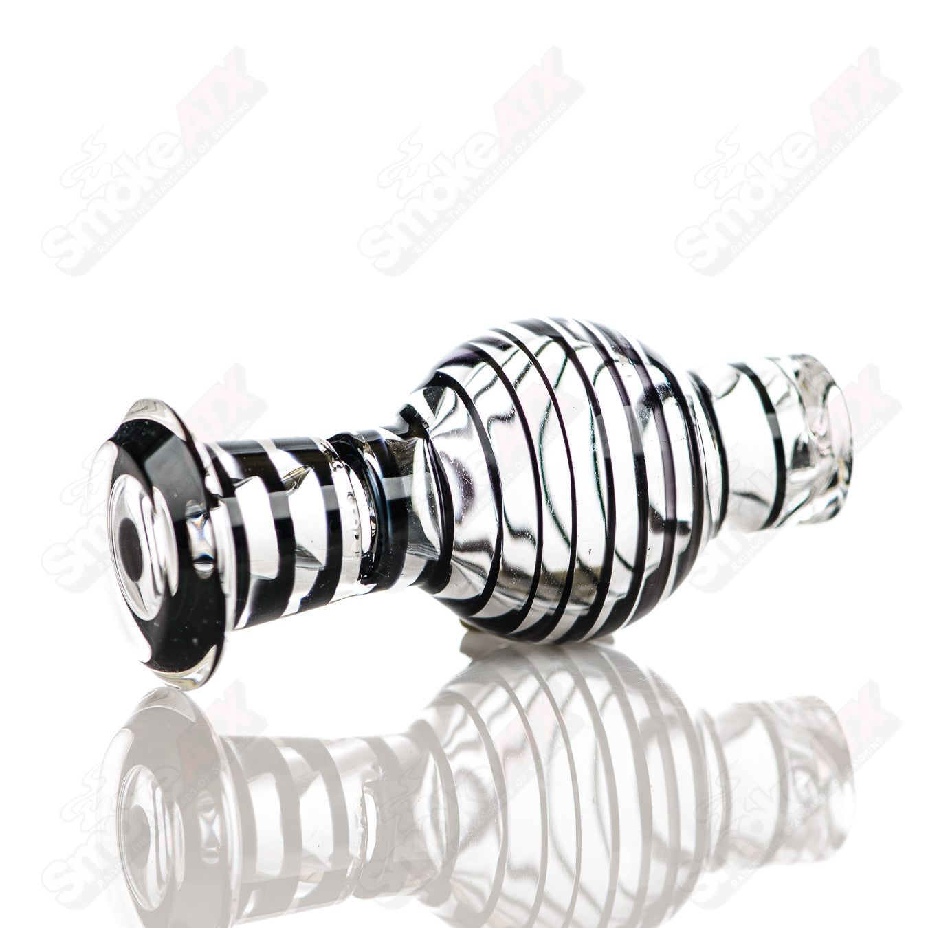 Clear and black striped V2 Spinner Cap glass carpenter carb cap for dabbing, featuring a sleek design and durable glass construction.