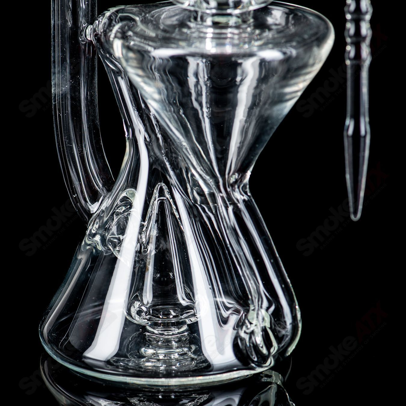 Clear Xhalecycler RAM Robert Mickelsen glass recycler, featuring intricate heady glass design and transparent craftsmanship.