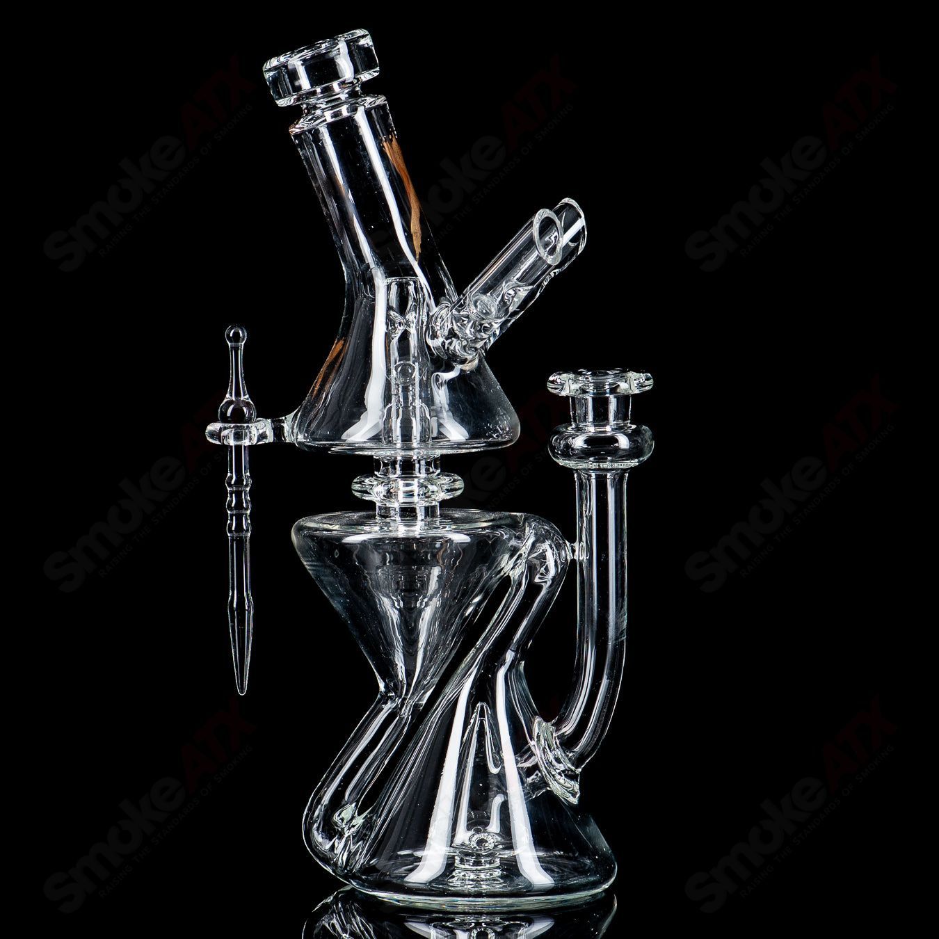 Clear Xhalecycler RAM recycler glass by Robert Mickelsen, featuring intricate heady glass design with transparent craftsmanship.