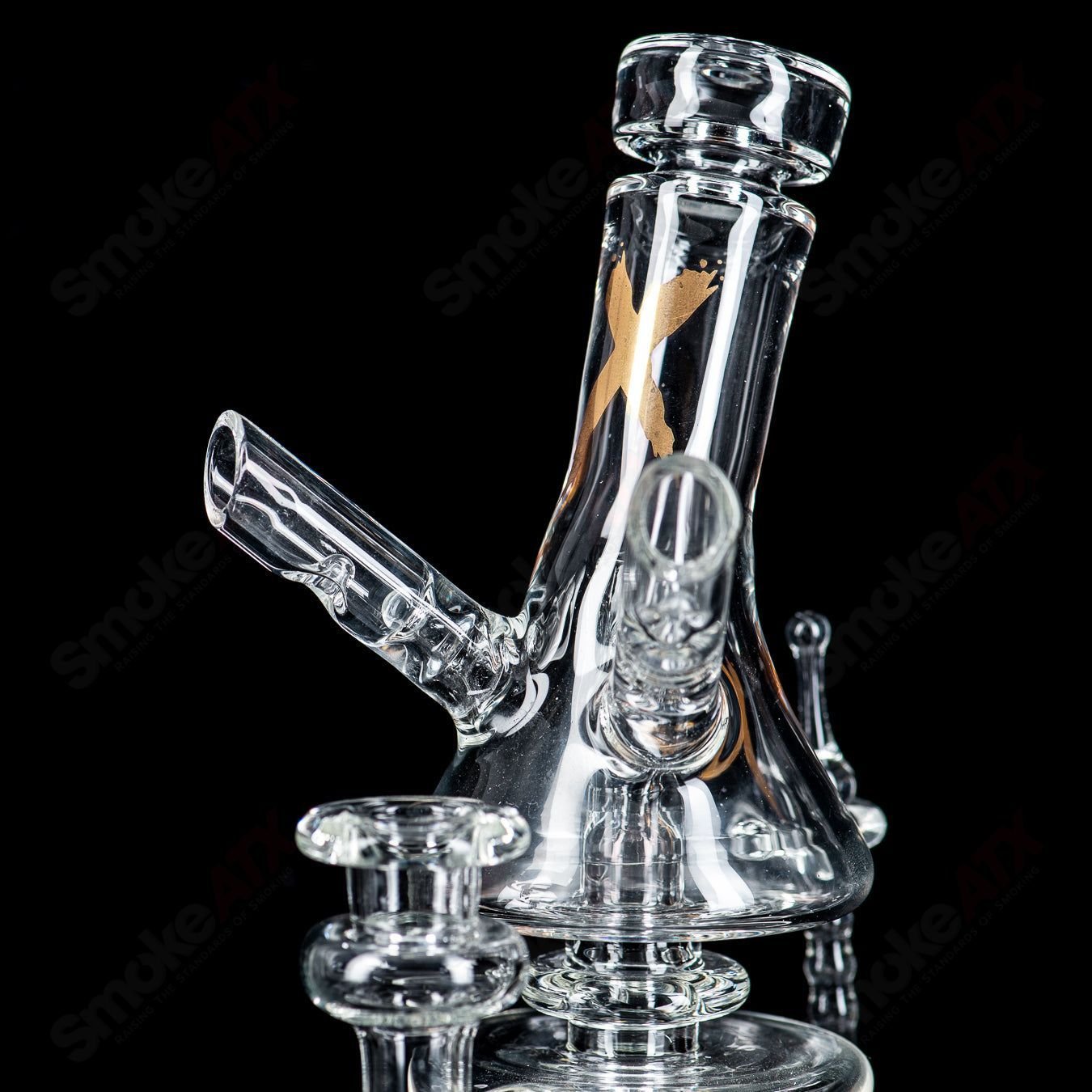 Clear RAM Xhalecycler recycler glass by Robert Mickelsen, featuring intricate heady glass design and transparent glass construction.