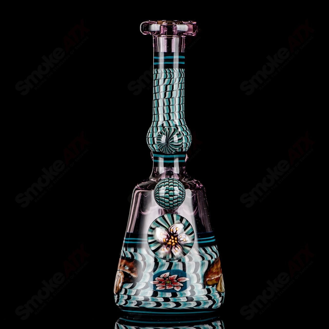 Coiled Latticello Milli Rig by Conversion Glass, a heady concentrate rig with intricate glasswork and coil design.