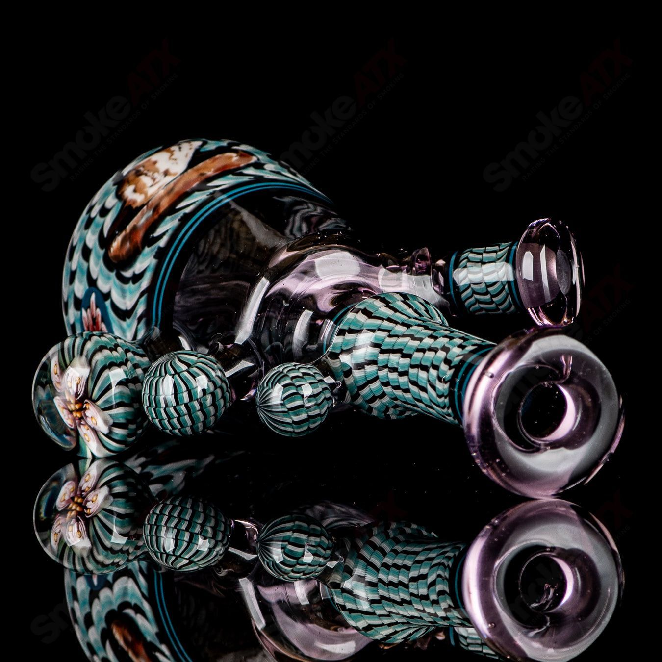 Coiled Latticello Milli Rig by Conversion Glass, a heady concentrate rig with intricate glasswork and vibrant colors.