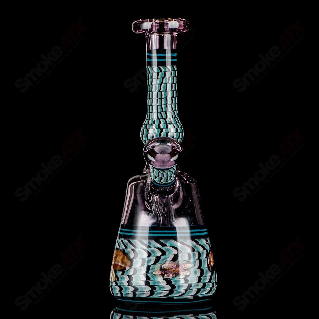 Coiled Latticello Milli Rig by Conversion Glass, a colorful heady concentrate rig with intricate coil design and Boehme craftsmanship.