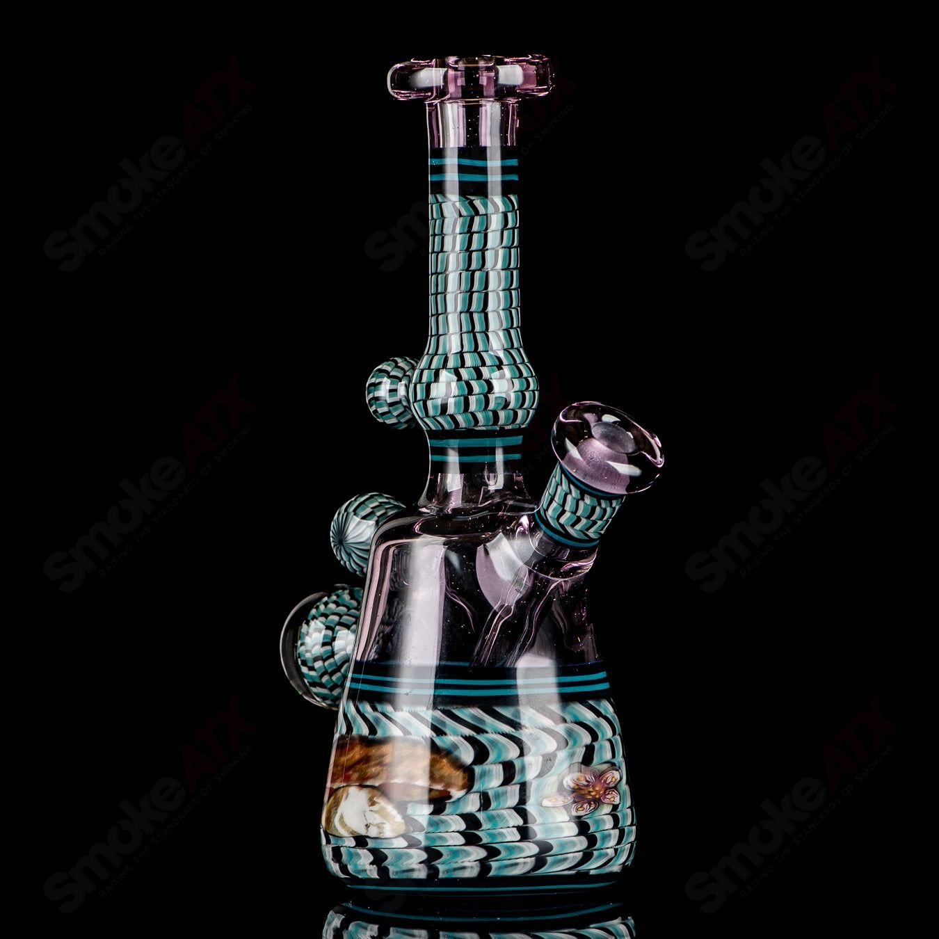 Coiled Latticello Milli Rig by Conversion Glass, a heady concentrate rig with colorful glasswork and intricate coil design.