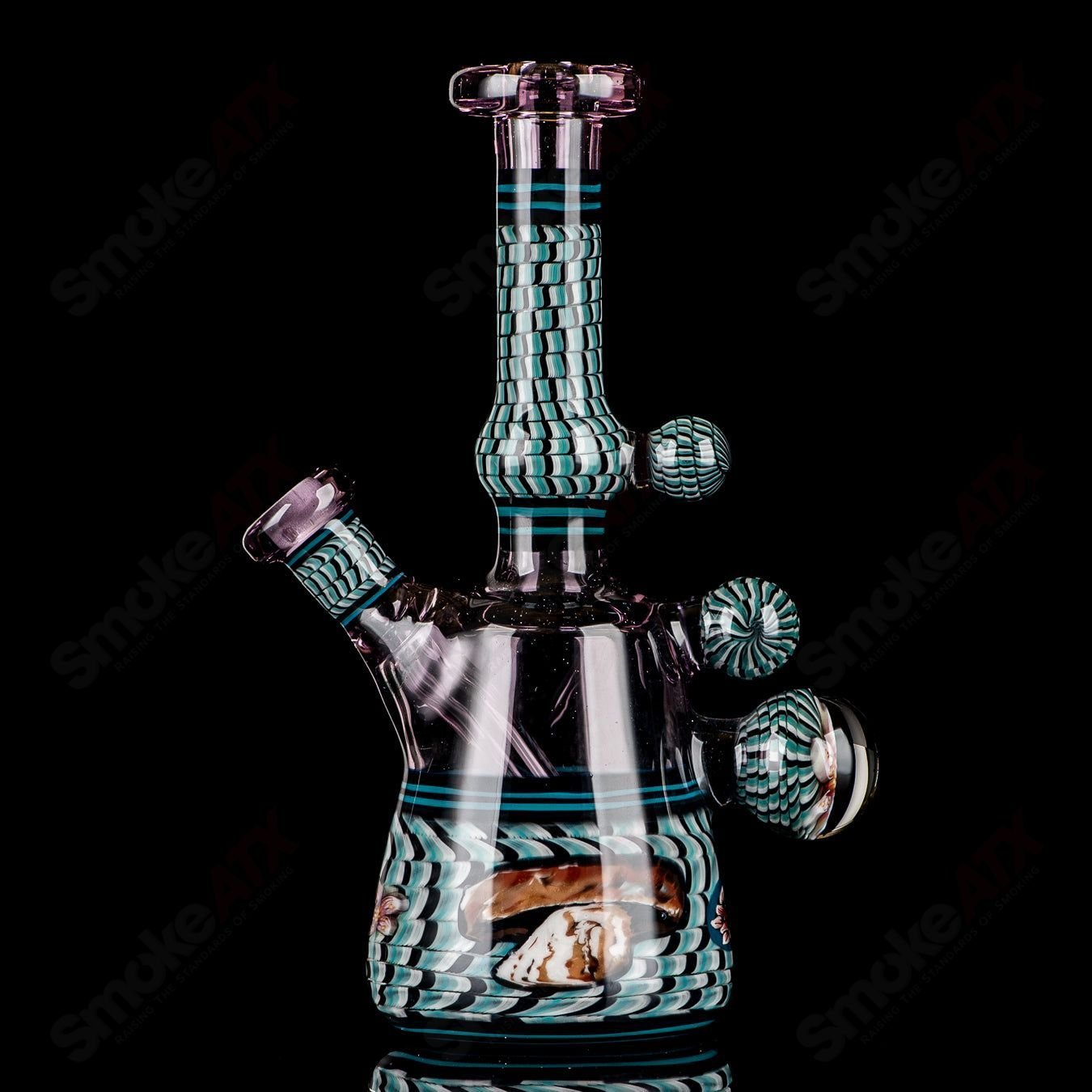 Coiled Latticello Milli Rig by Conversion Glass, a colorful heady glass concentrate rig with intricate coil design and vibrant details.