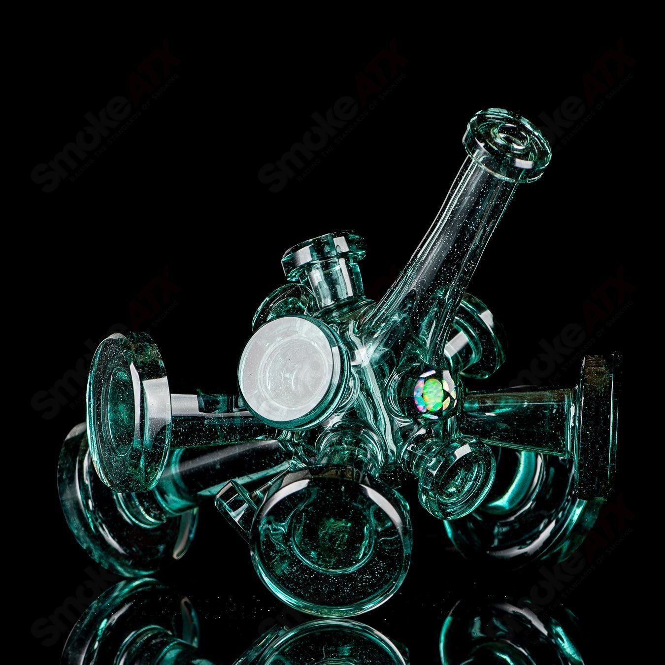 Color Spore Rig by JMass, a vibrant heady glass concentrate rig with colorful, intricate design details.