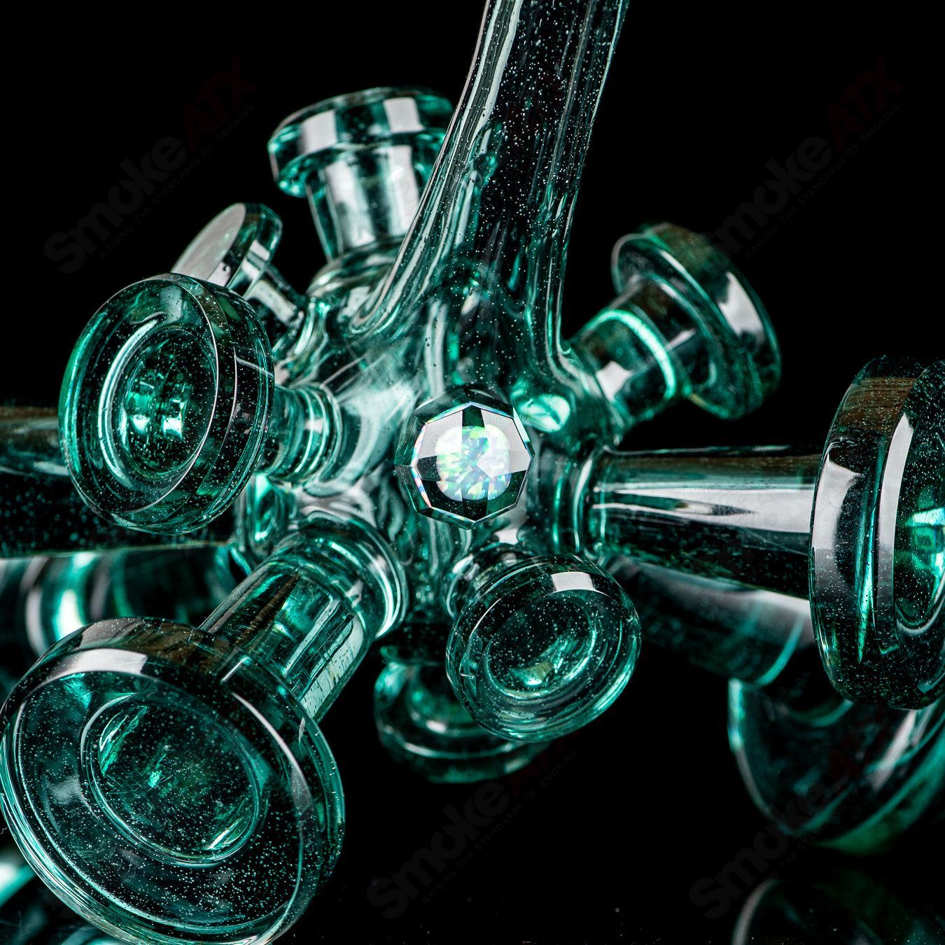 Color Spore Rig by JMass, a vibrant heady glass concentrate rig with colorful spore-like patterns and intricate design details.