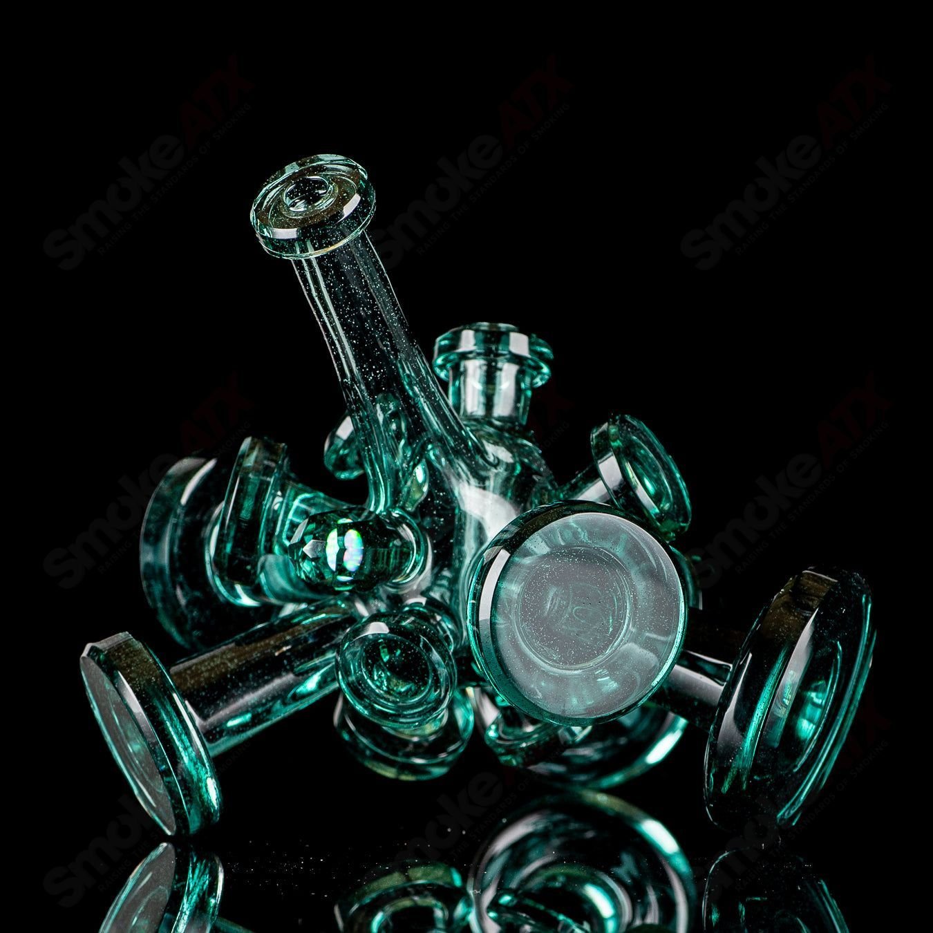 Color Spore Rig by JMass, a vibrant heady glass concentrate rig with colorful spore-like patterns and intricate glasswork.