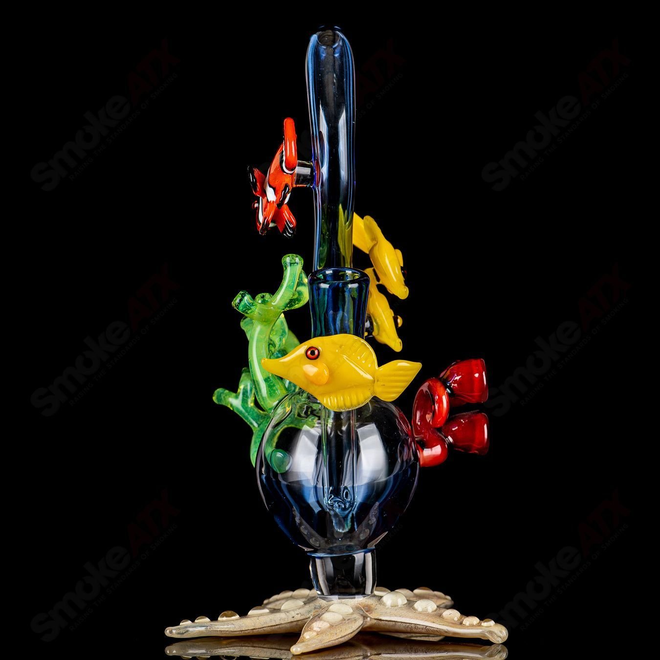 JRod Glass Coral Reef Rig, a colorful heady glass concentrate rig with coral reef design and intricate glasswork.