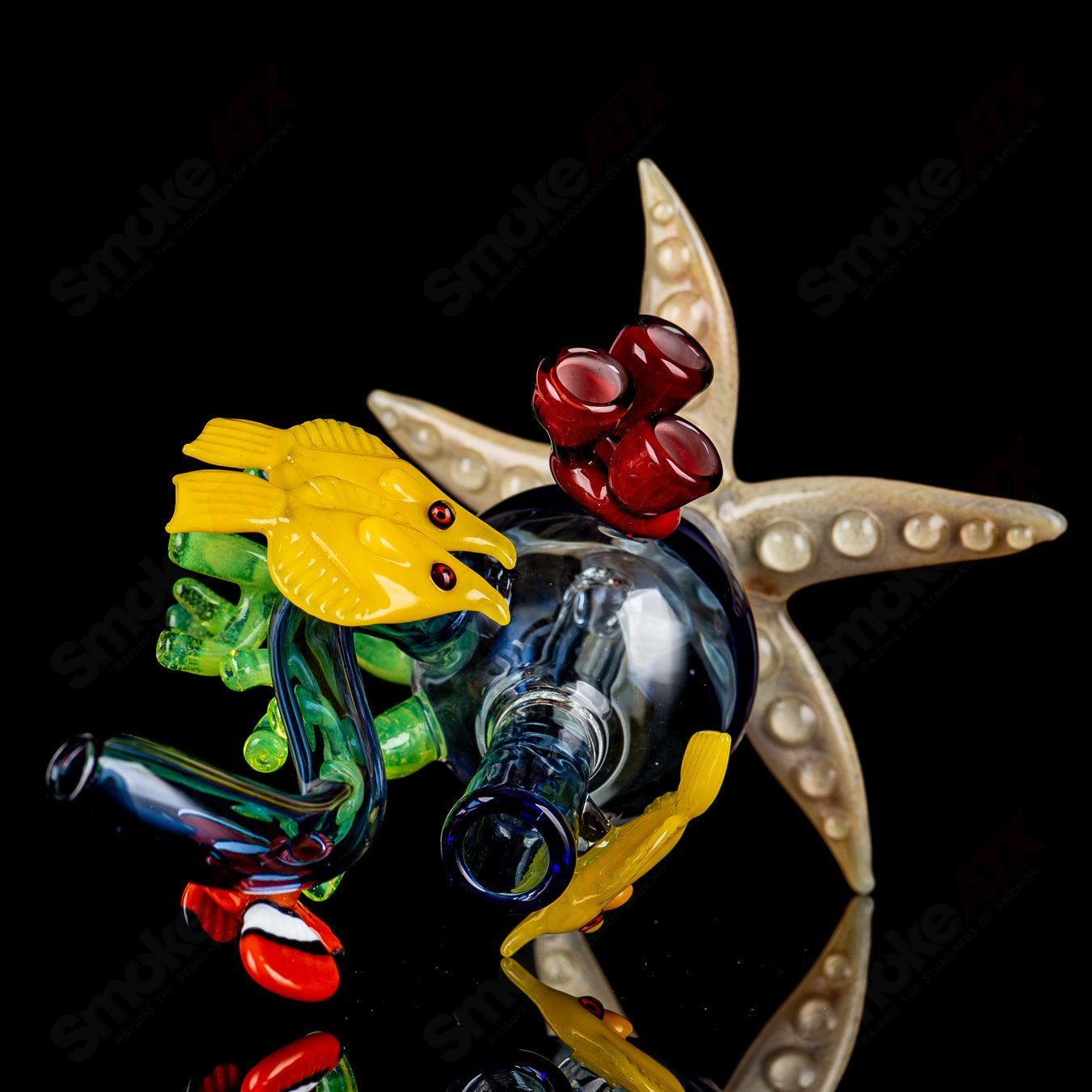 JRod Glass Coral Reef Rig, a heady concentrate rig with vibrant coral reef design and clear glass construction.