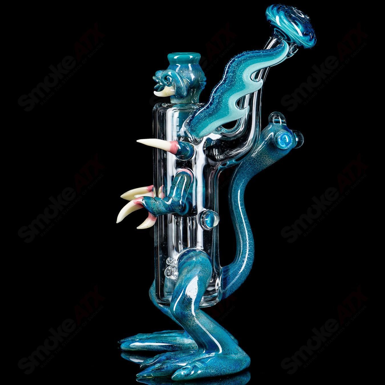 Creature Rig by E. Ross X SALT, a colorful heady glass concentrate rig with intricate creature-shaped design and glass accents.