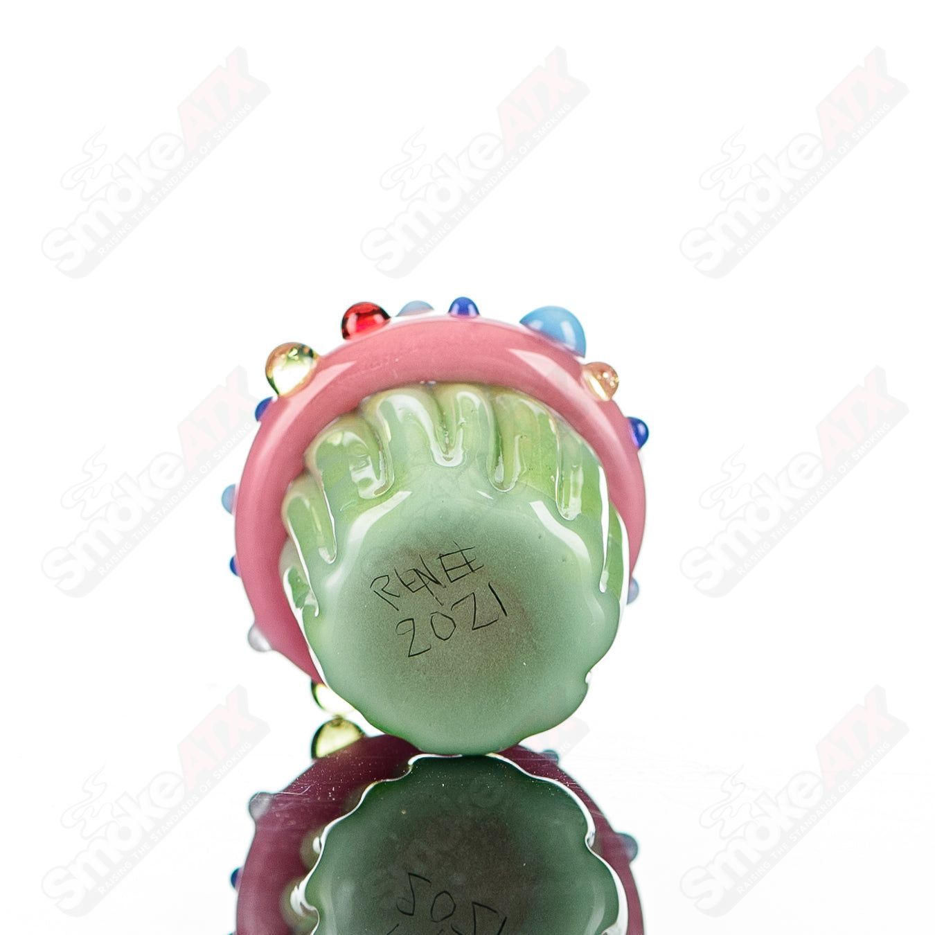 Glass cupcake pendant with mint wrapper, pink frosting, and multicolor sprinkles by Sweet Shop Glass, designed by Renee Patula.