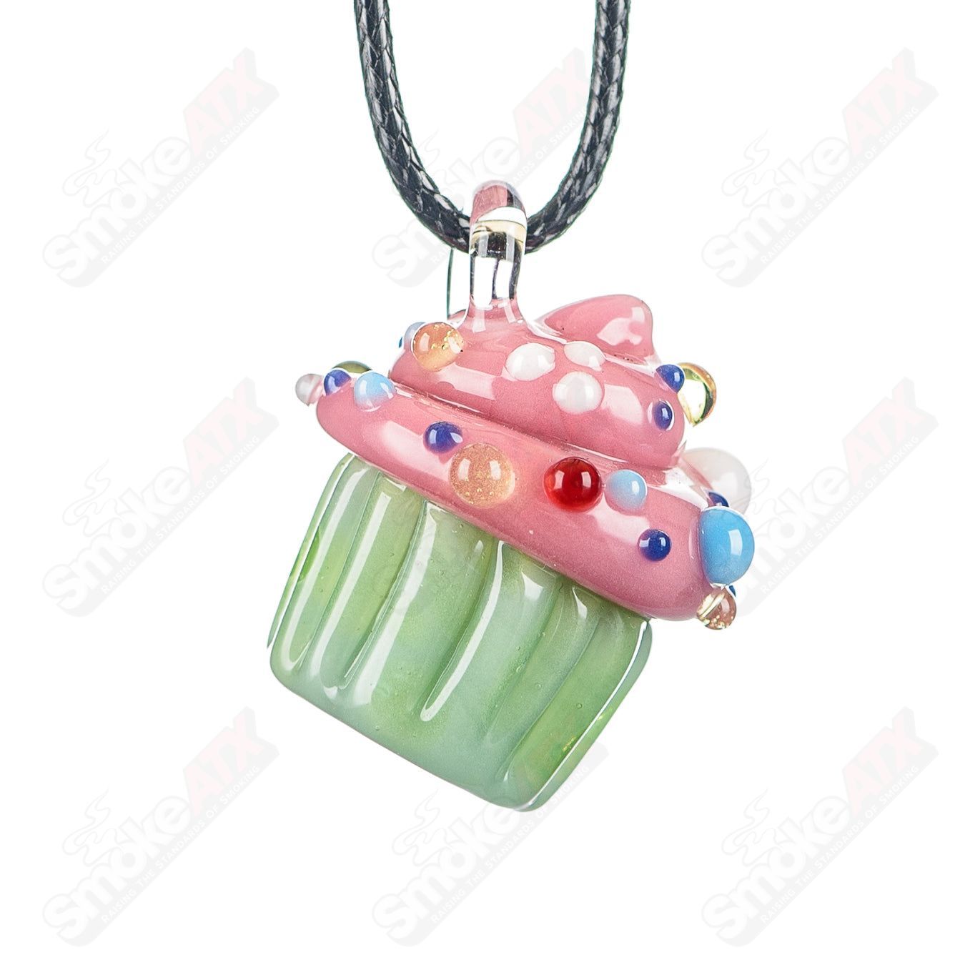 Glass cupcake pendant with mint wrapper, pink frosting, and multicolor sprinkles by Sweet Shop Glass, designed by Renee Patula.