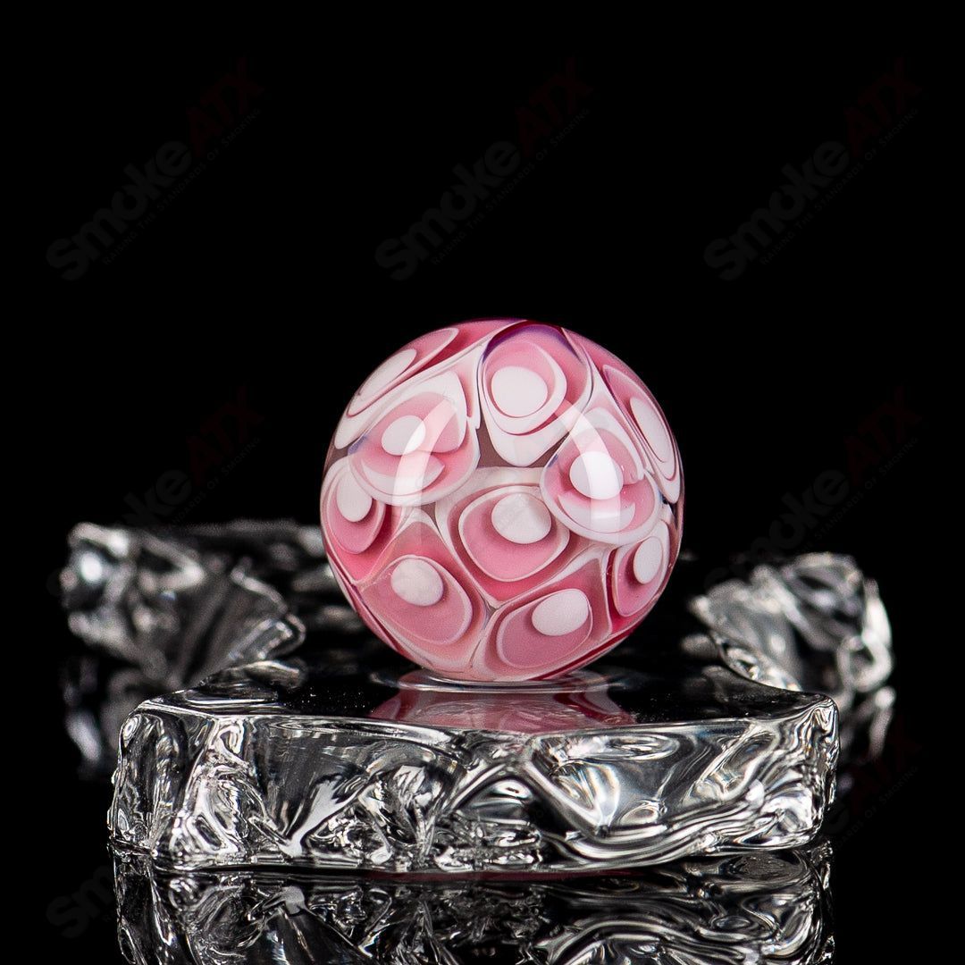 Colorful Gold Ruby Dotstack Mib Indo Glass marble showing vibrant red and gold patterns on smooth glass surface.