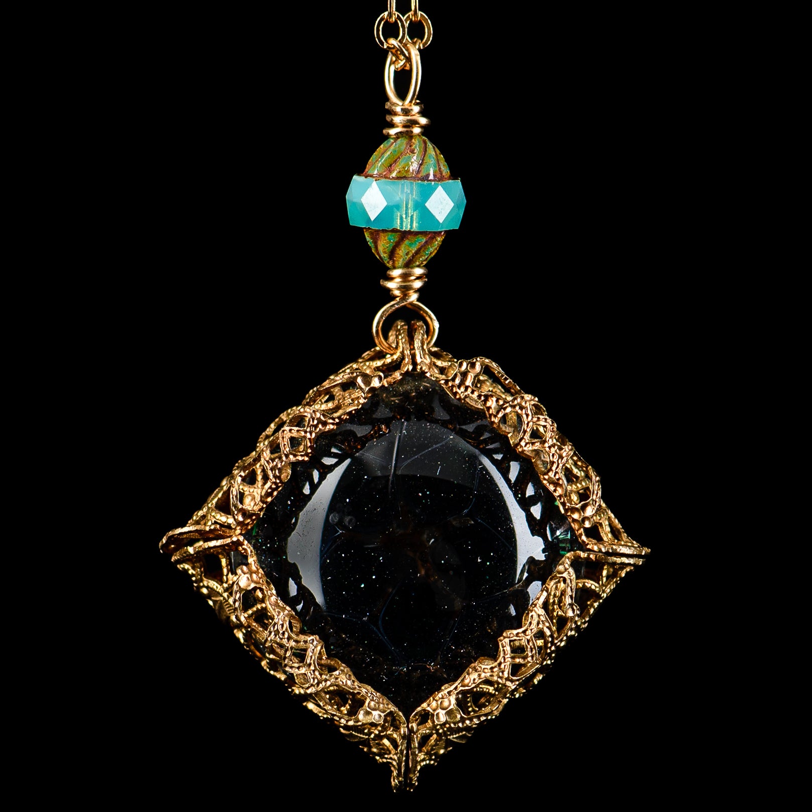 Glass pendant chain featuring a UV dot brass pendant from Pake, showcasing a stylish and modern jewelry design.