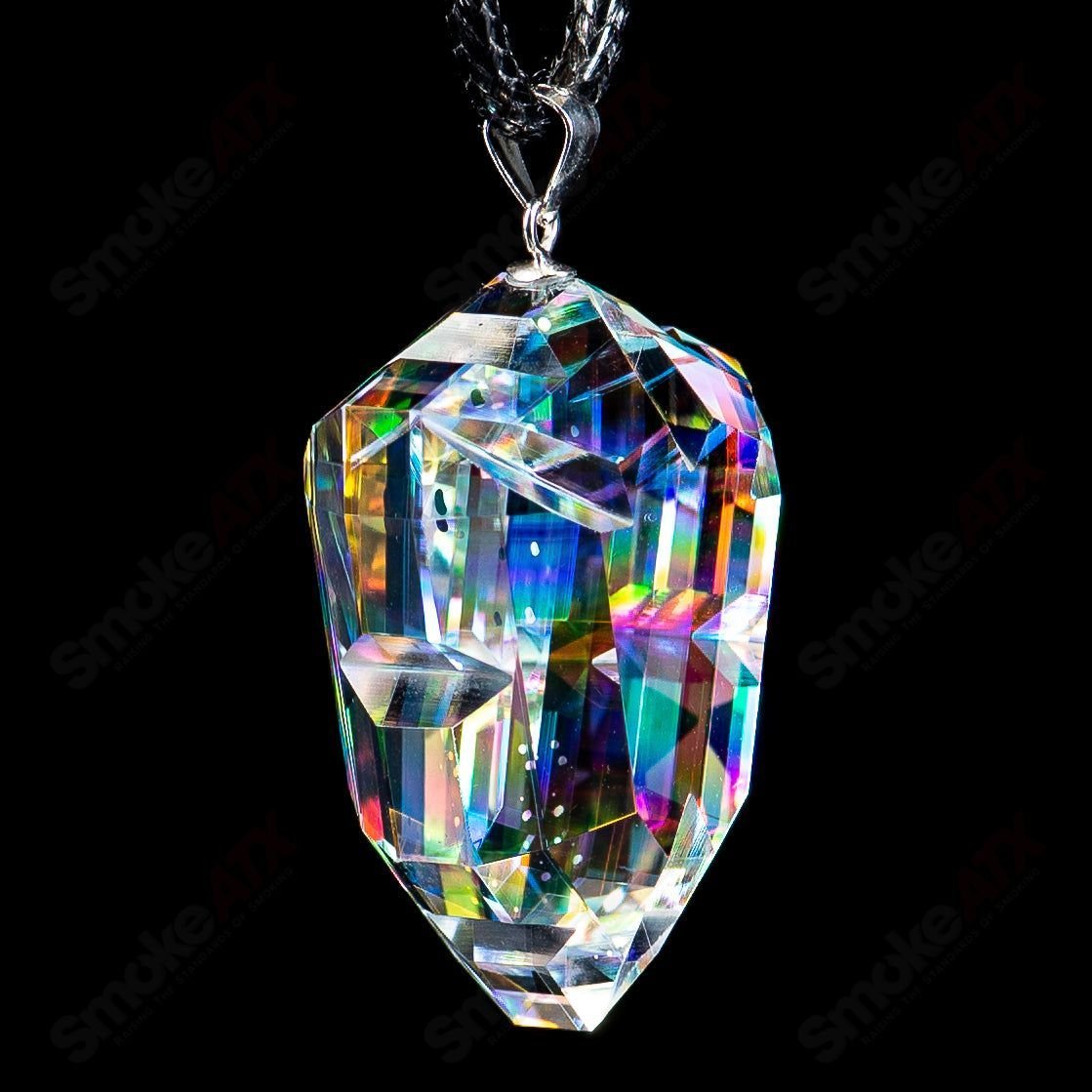 Dichro Arrow Head Faceted Pendant by Fatal Facets, handmade glass head pendant with iridescent colors and intricate faceted design.