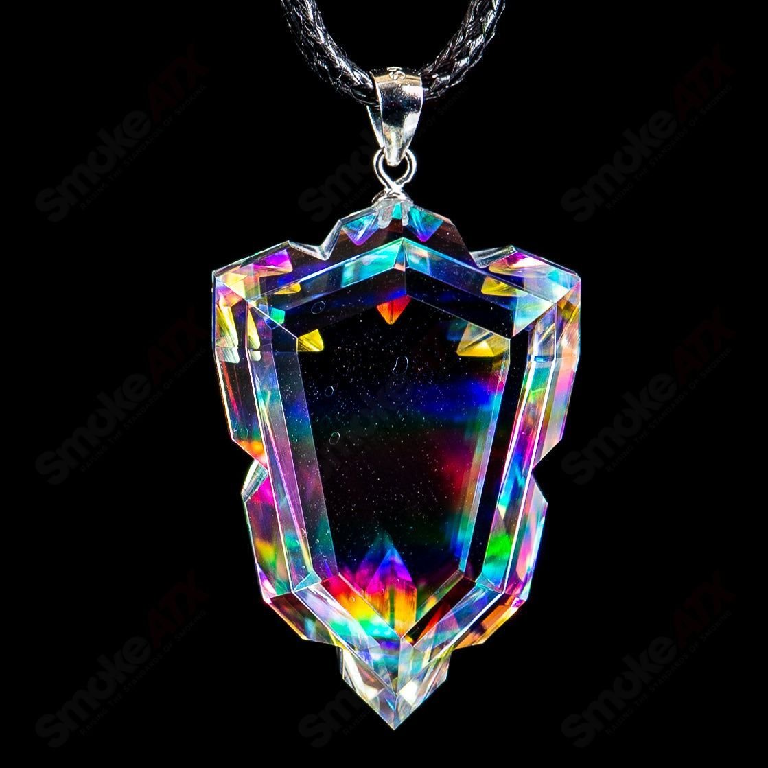 Dichro Arrow Head Faceted Pendant by Fatal Facets, handcrafted glass head with colorful, shimmering facets, on a silver chain.