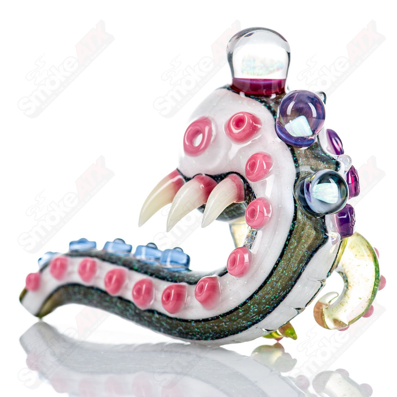 Dichro Monster Sherlock heady glass pipe signed by Harold Ludeman, featuring vibrant colors and detailed Sherlock design from Salt Glass.