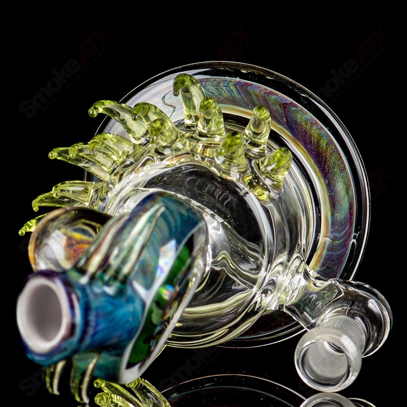Colorful Freeek Glass Disc Rig in lime and purple with a sleek heady glass design for concentrates.