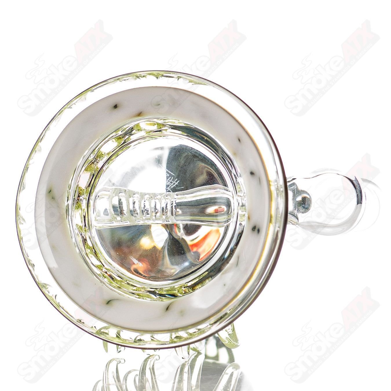 Colorful Freeek Glass disc rig in lime and purple for concentrates, featuring a sleek heady glass design.