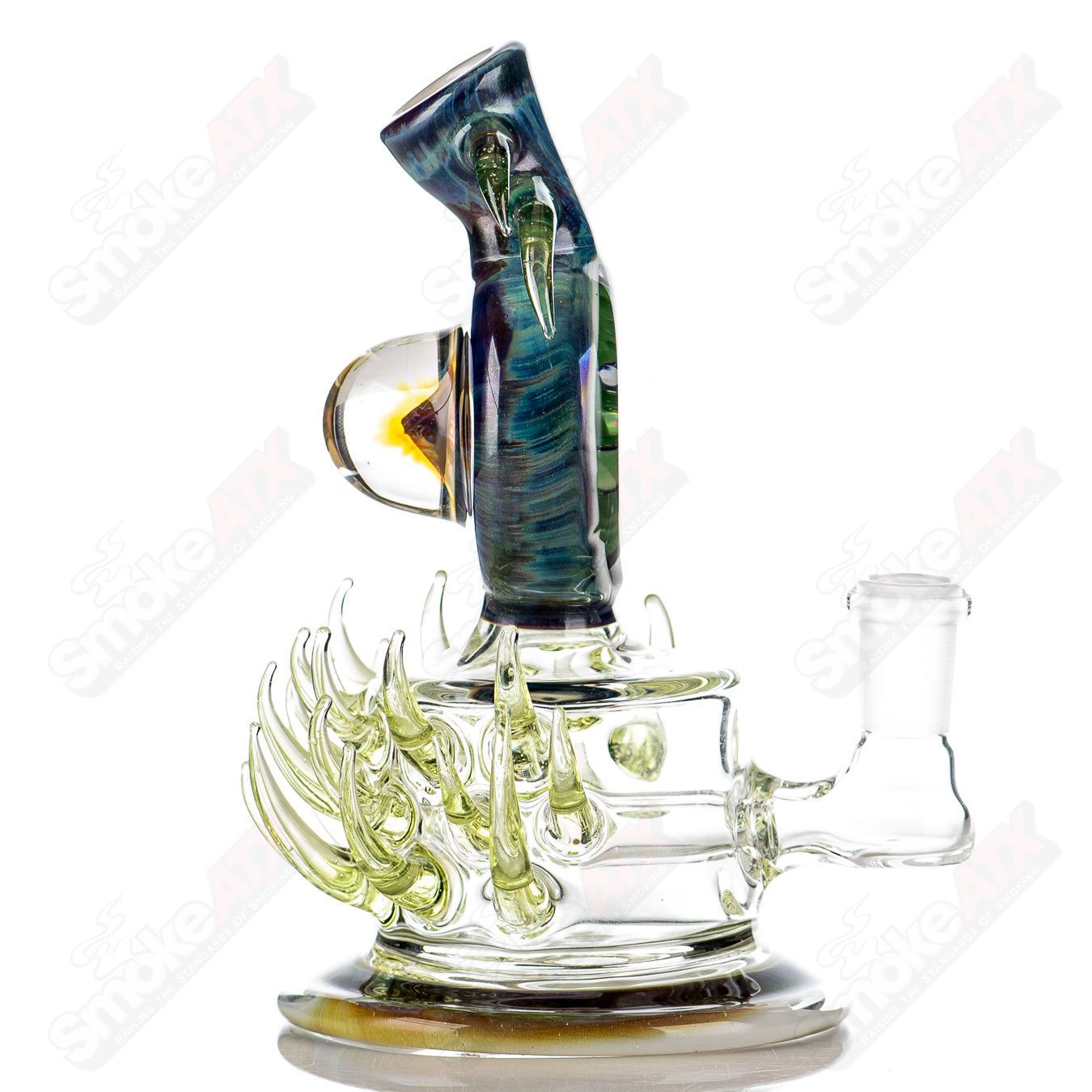 Colorful Freeek Glass disc rig for concentrates with lime and purple accents, featuring a sleek heady glass design.