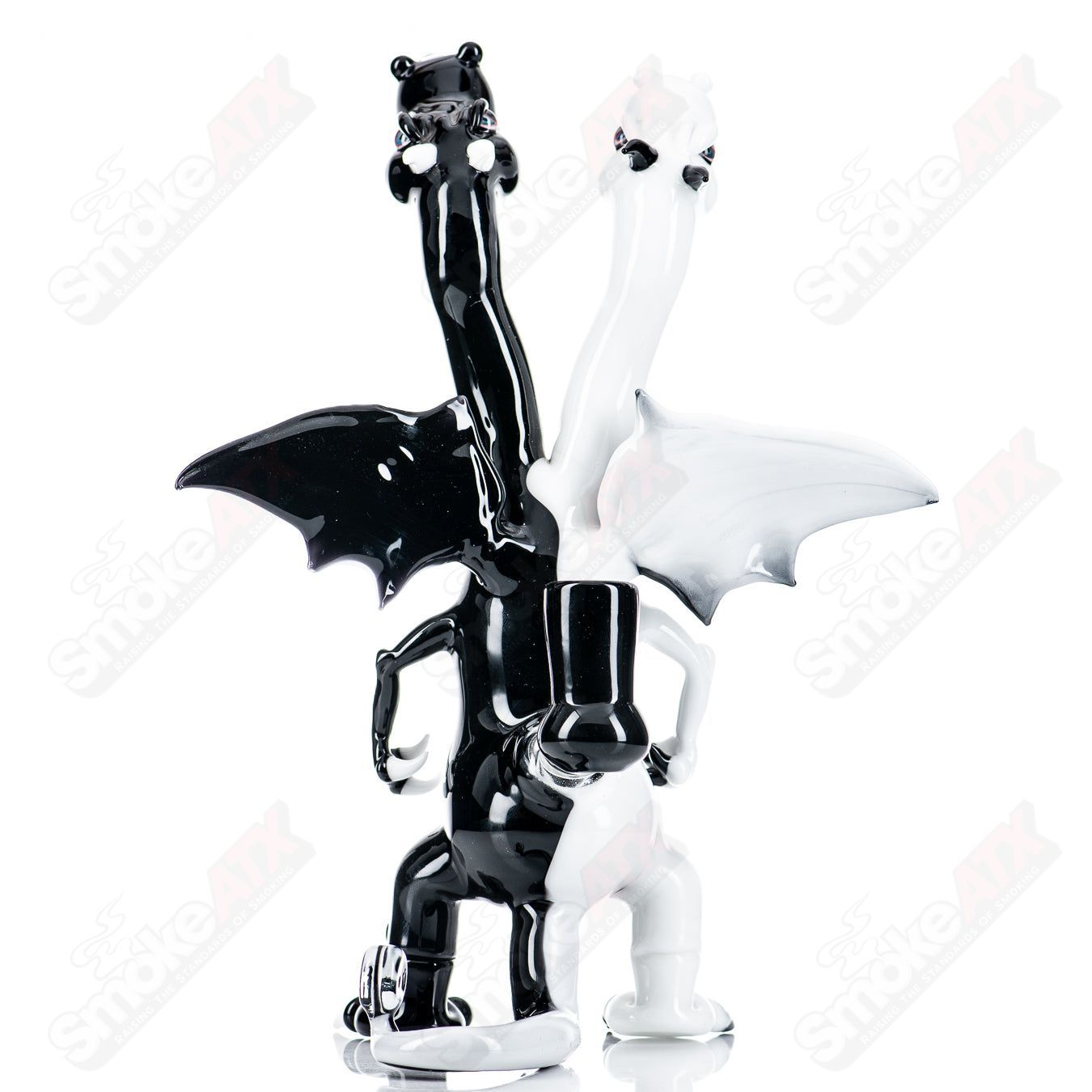 Double-headed dragon Hendy glass concentrate rig featuring intricate dragon designs and clear glass construction.