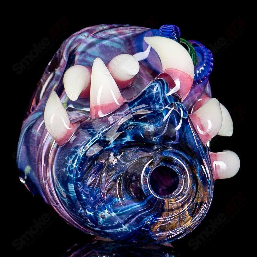 Hand pipe made of colorful heady glass by Salt Glass, featuring intricate designs and a classic dry pipe shape for smoking.