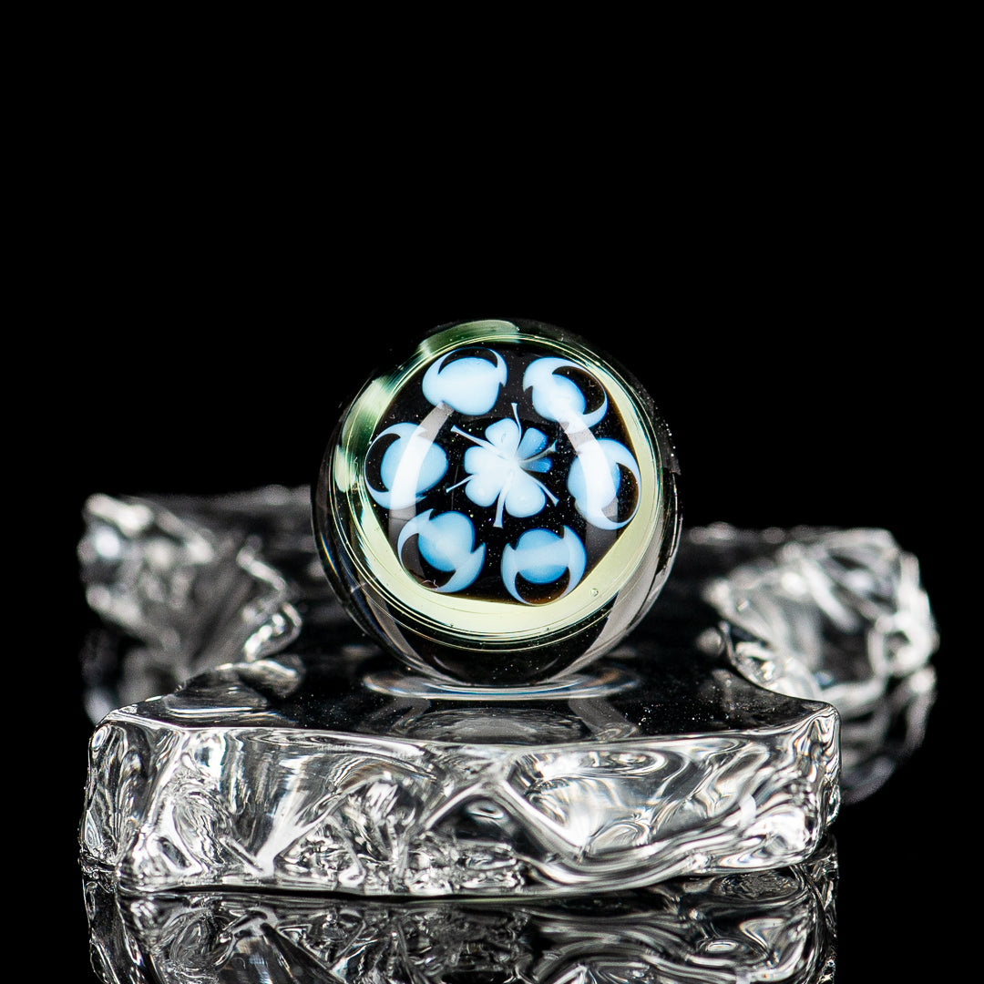 Colorful UV Dotstack Skull Marble from Indo Glass, featuring vibrant dots and a detailed skull design in clear glass