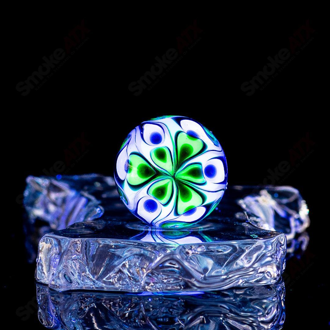 Colorful Dotstack crushed opal UV glass marbles by Indo Glass, featuring vibrant patterns and a glossy finish in a close-up shot.