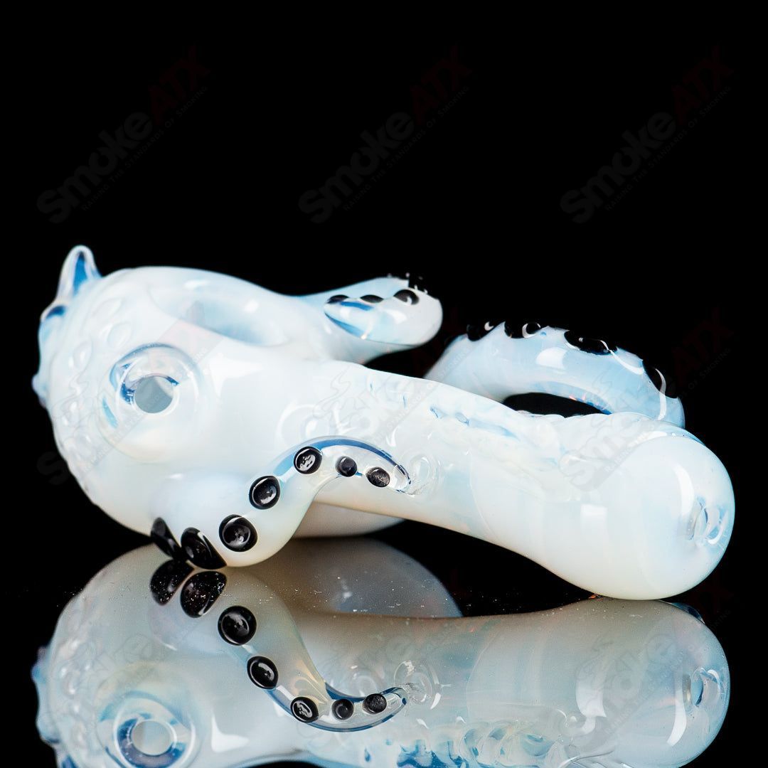 Mako Glass Seamonster Spoon hand pipe with colorful glass design, featuring a detailed sea creature motif.