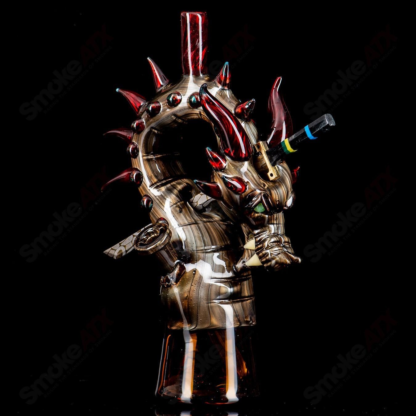 Electrum Dragon Rig by Tony Kazy, a heady glass concentrate rig with intricate dragon design and vibrant glasswork.