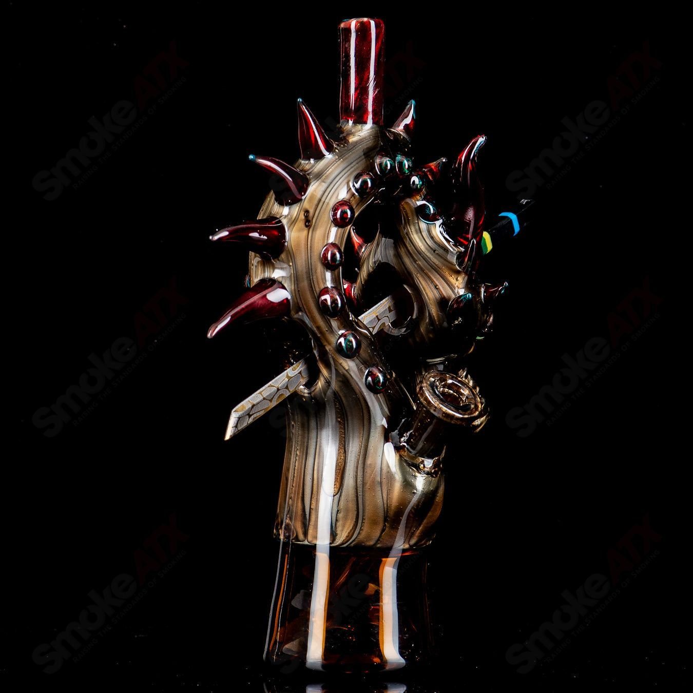 Electrum Dragon Rig by Tony Kazy, a heady glass concentrate rig with detailed dragon design and vibrant colors.