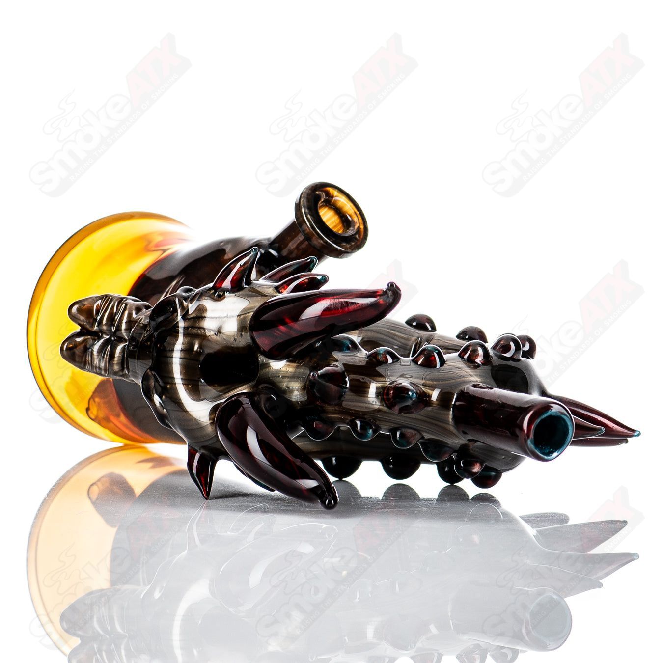 Electrum Dragon Rig by Tony Kazy, a unique heady glass concentrate rig with intricate dragon design and vibrant glasswork.