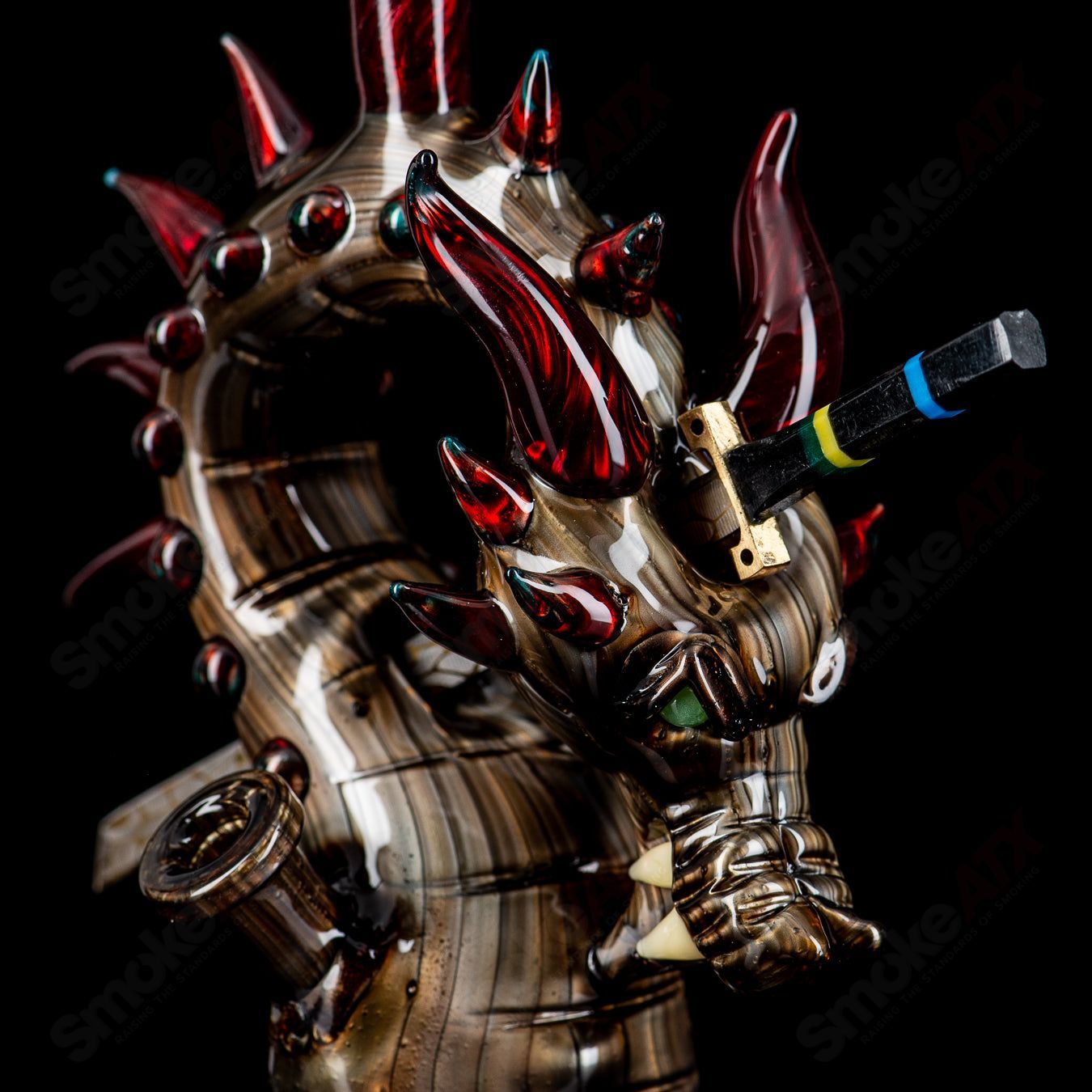 Electrum Dragon Rig by Tony Kazy, a colorful heady glass concentrate rig with dragon design and intricate details.