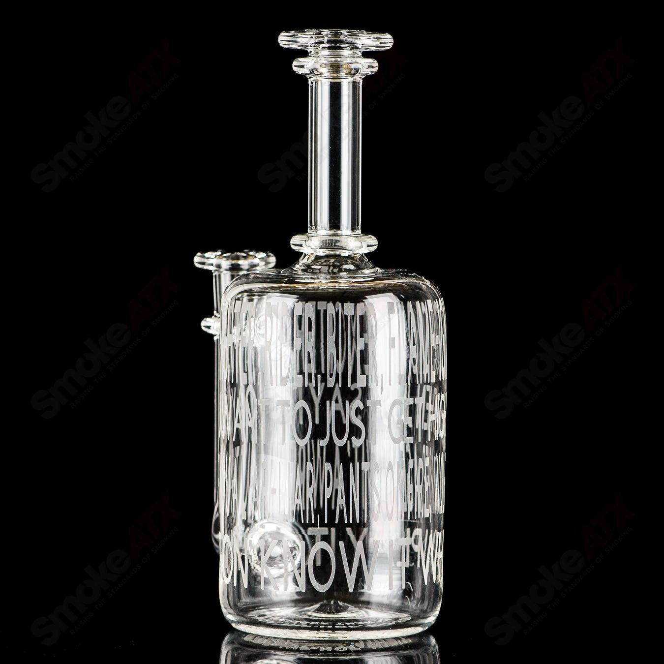 Kage Glass Etched Lyric Rig for concentrates featuring Dead Prez and hip-hop-inspired design, made of clear glass with etched artwork.