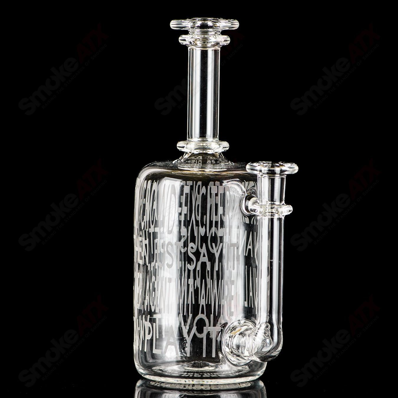 Kage Glass etched Lyric Rig for concentrates featuring Dead Prez Hip-Hop design, showcasing intricate glass artwork and shape.