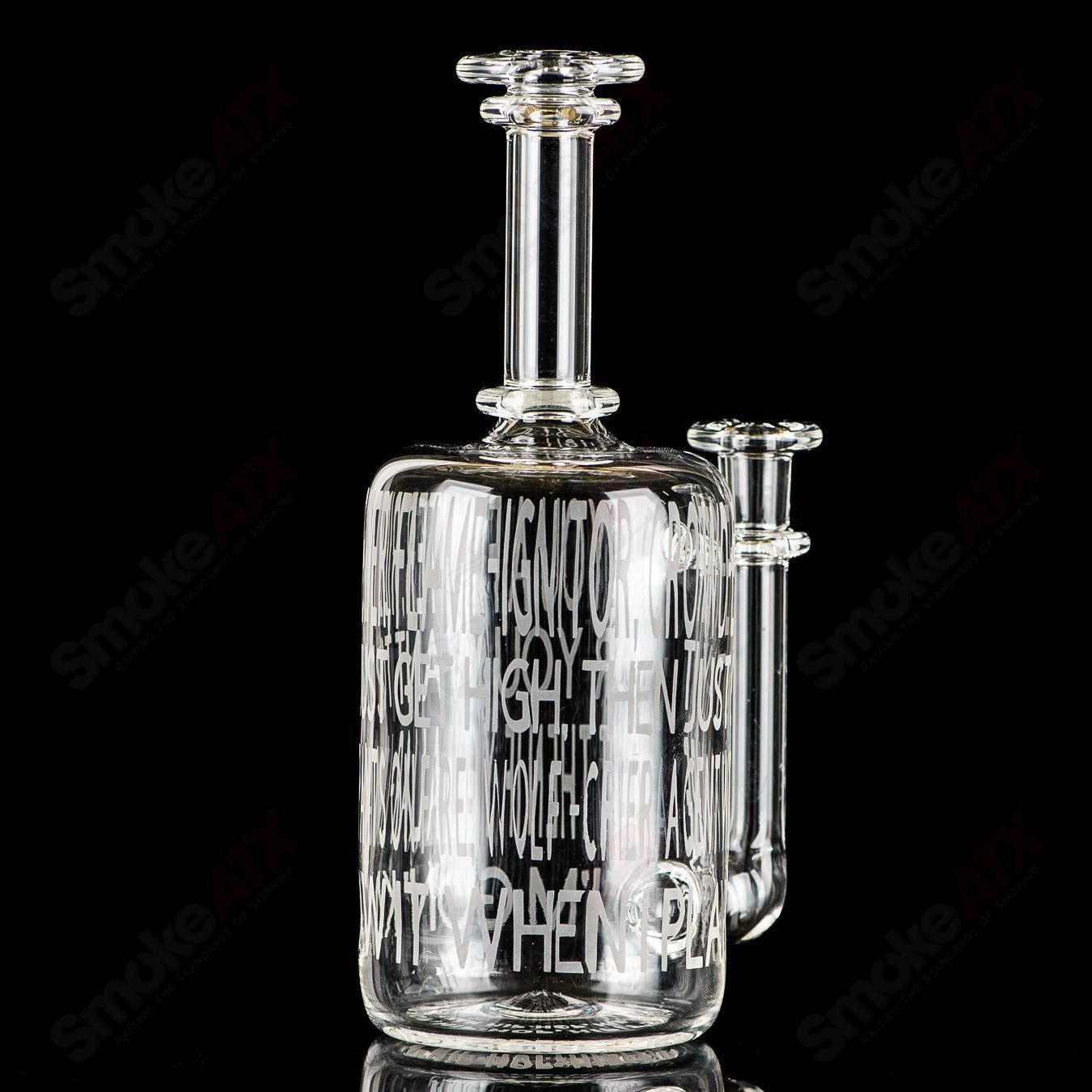 Kage Glass etched Lyric Rig for concentrates featuring Dead Prez and hip-hop-inspired design, made of clear glass with detailed etching.