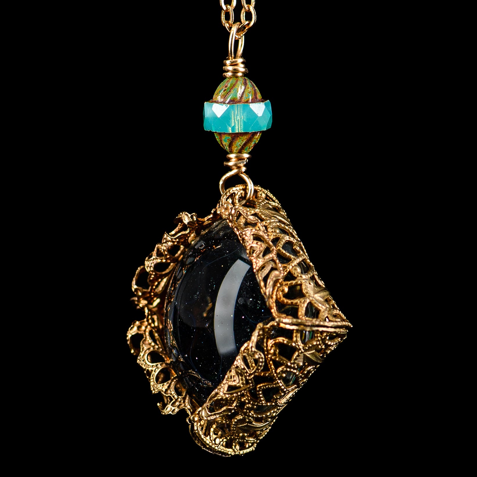 Glass UV Dot Stack Brass Pendant Chain by Pake, featuring a stylish brass chain with a vibrant glass pendant.