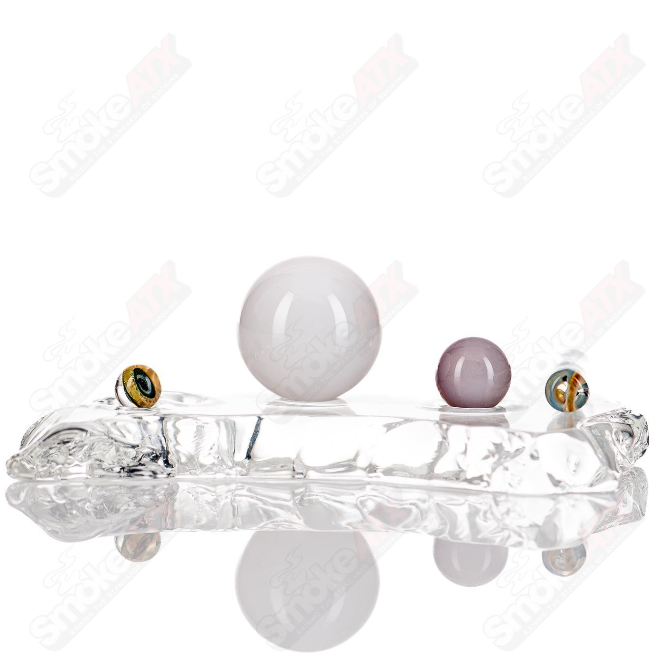 Indo Glass Eye Slurper Set featuring colorful heady glass with unique eye-shaped design and multiple slurper attachments.