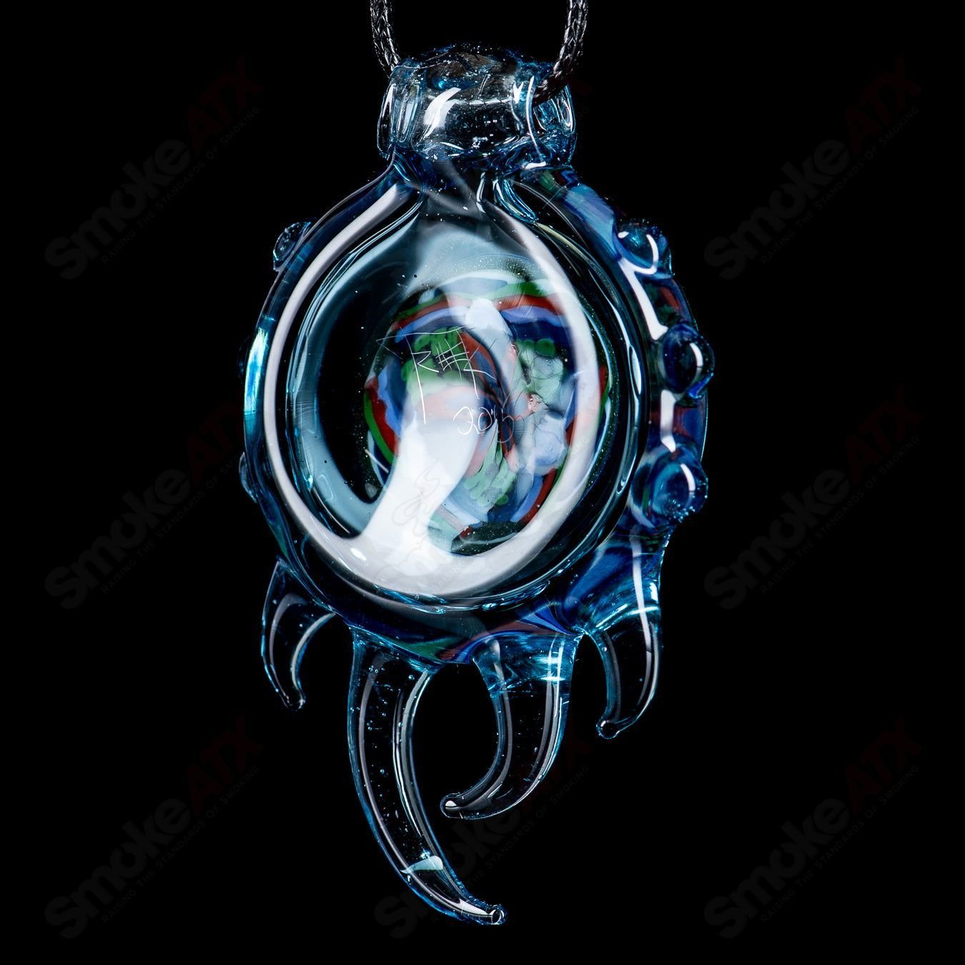 Colorful Fillacello Pendant by Freeek Glass featuring intricate heady glass design with vibrant patterns and glass detailing.
