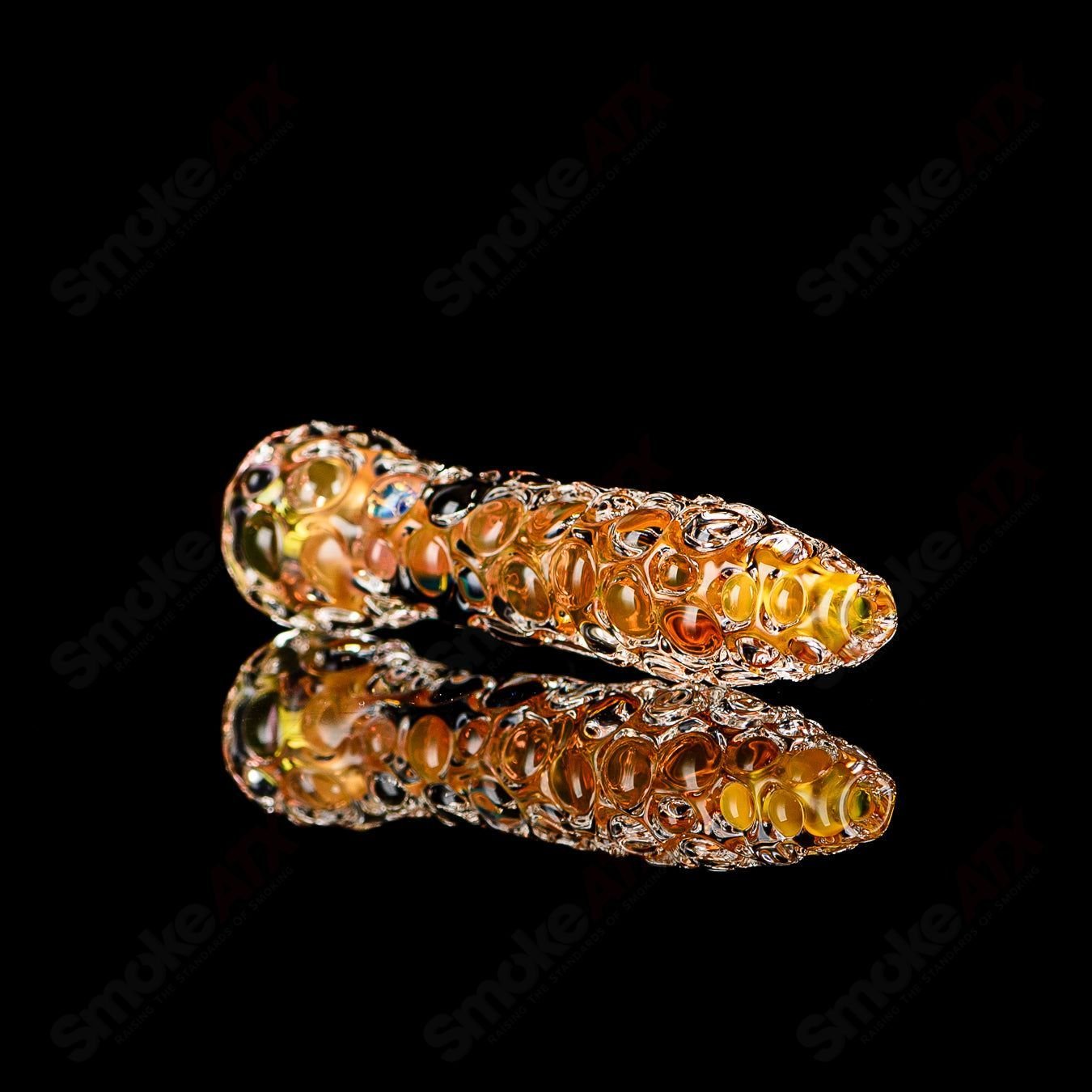 Fumed hobnail glass chillum with black dot signature by JMK Glass, showcasing intricate textured design and craftsmanship.
