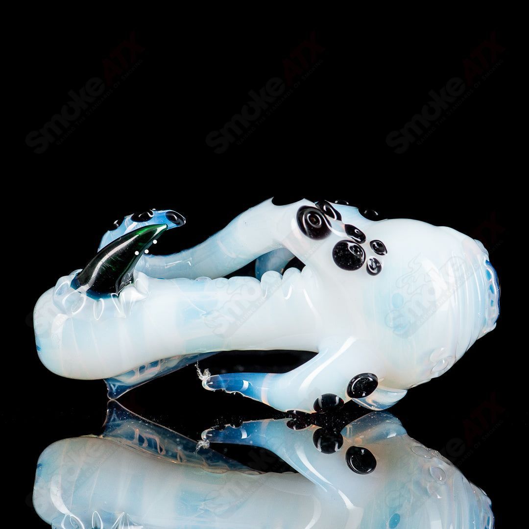 Mako Glass Seamonster Spoon hand pipe featuring a detailed sea creature design in vibrant colors.
