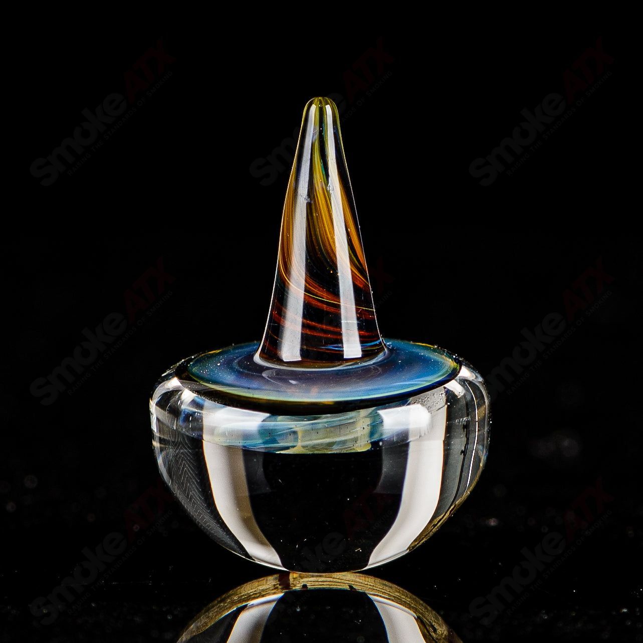 Indo Glass Galactic Spike Topper carb cap made of clear glass with a spiked design for use with dab rigs and concentrates.