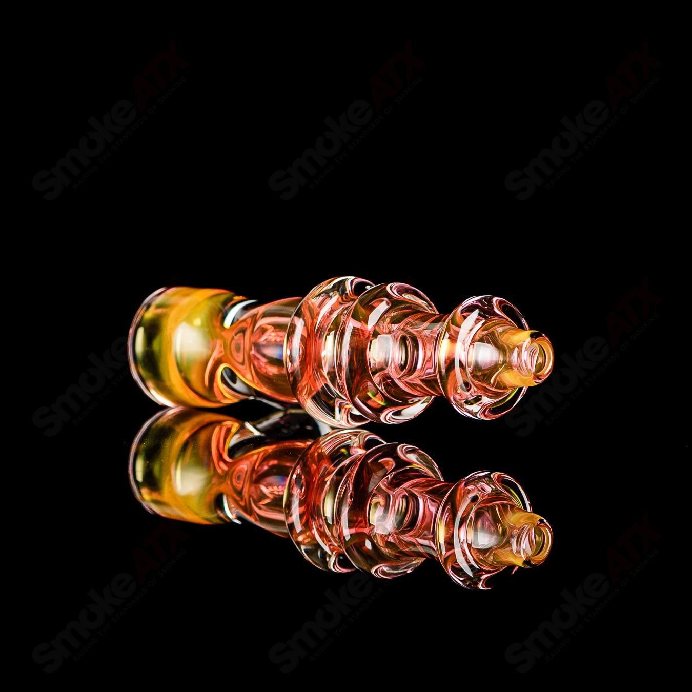 Gold fumed triple maria glass chillum with clear dot signature by JMK Glass, showcasing intricate design and vibrant gold accents.