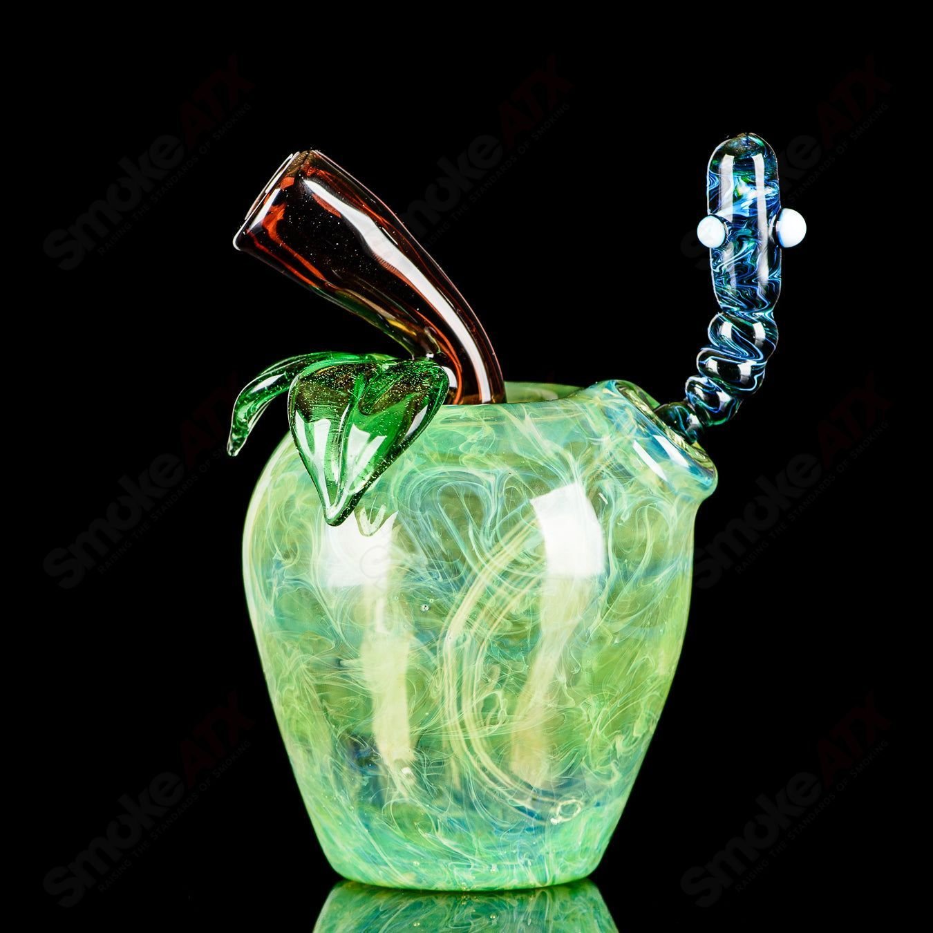 Green Apple Heady Glass concentrate rig with worm dabber and pouch, featuring vibrant green apple design and clear glass details.