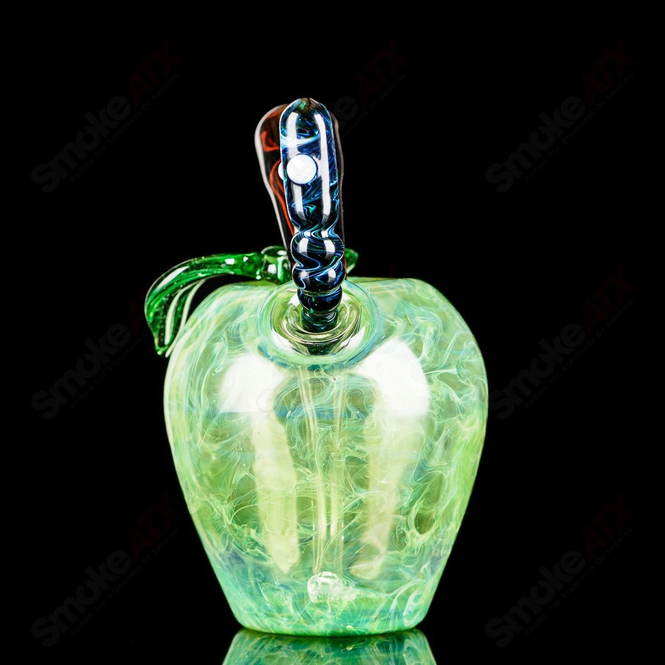 Green Apple concentrate rig with worm dabber pouch from Pouch Glass, featuring vibrant green glass and detailed design.
