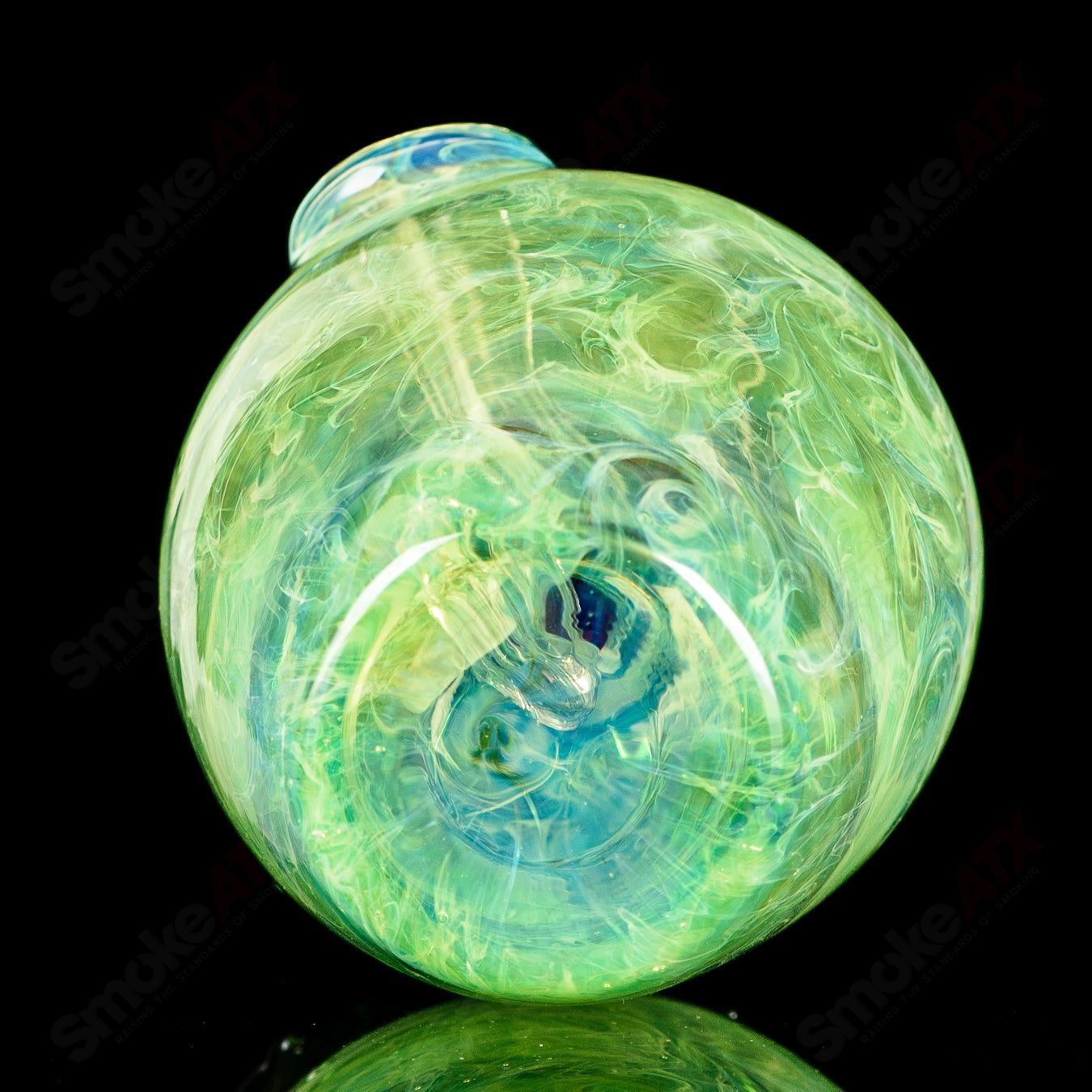 Green apple-shaped rig with worm dabber pouch from Pouch Glass, a heady glass concentrate rig featuring vibrant green glass and detailed design.