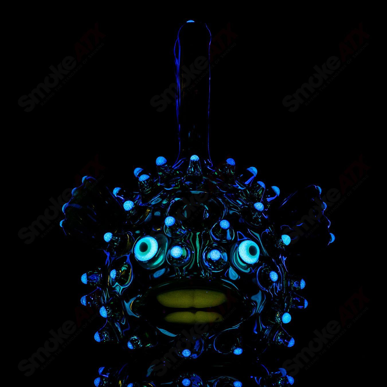 Green puffer concentrate rig with glow accents by Chadd Lacy Glass, featuring a detailed design and vibrant color.